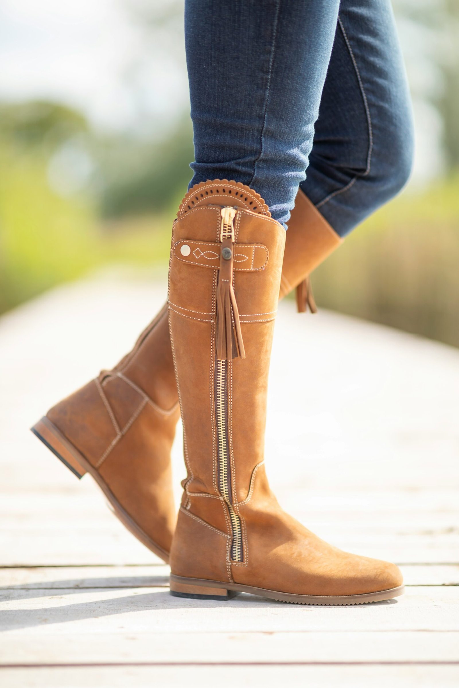 A close up of a person wearing boots